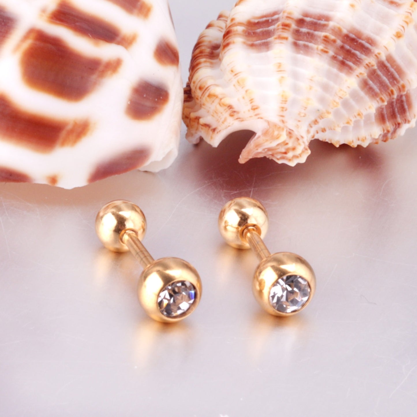 Elegant Sparkle Stud gold earrings flat lay – poke free children's earrings by Twisty Locks