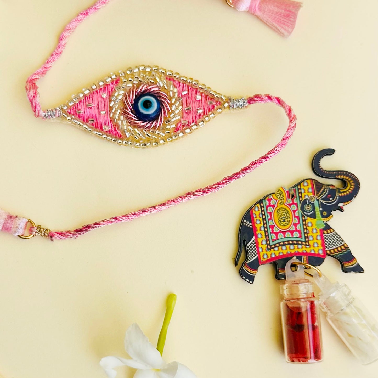 Evil Eye Embroidered Rakhi with Roli & Chawal - Pink - Twisty Locks - Kids Hair Accessories India