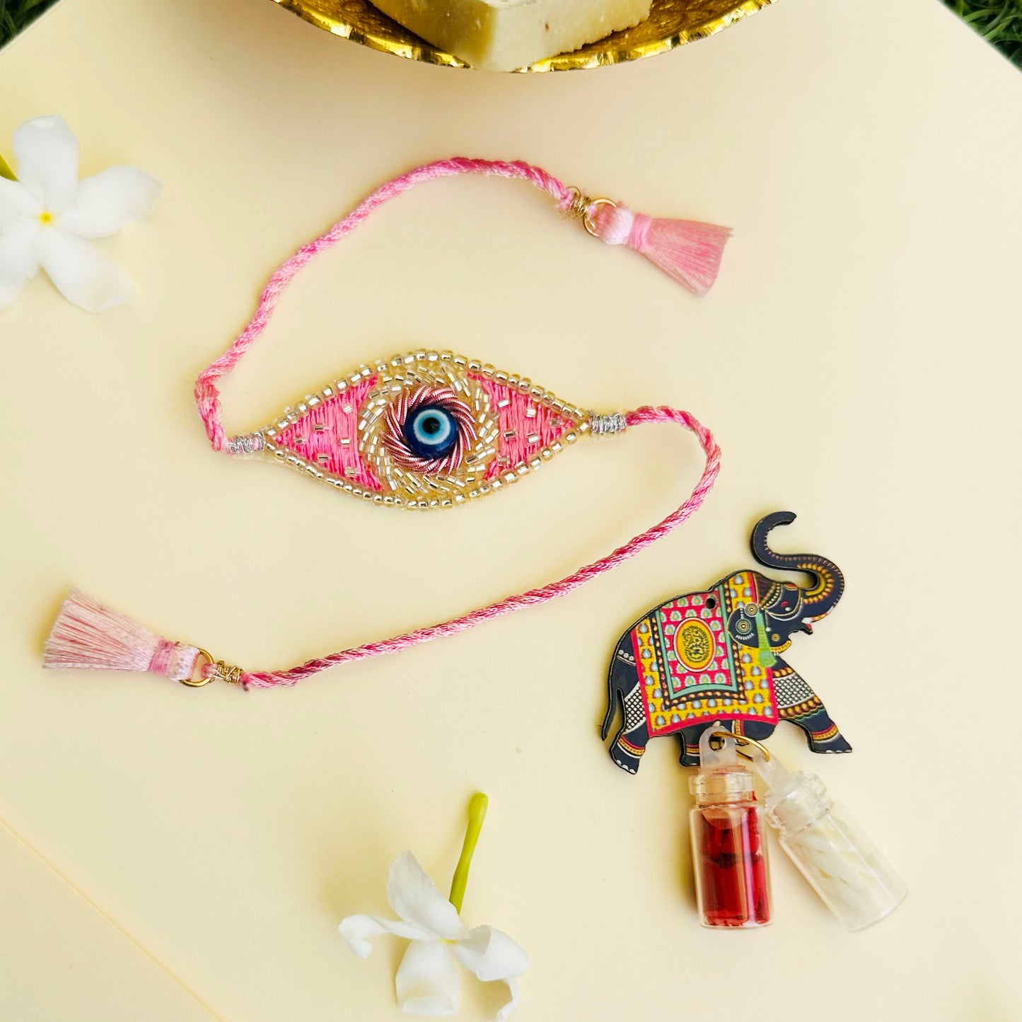Evil Eye Embroidered Rakhi with Roli & Chawal - Pink - Twisty Locks - Kids Hair Accessories India