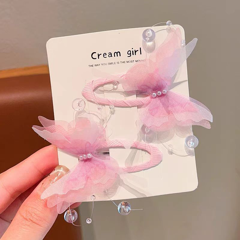 Pink Organza Butterfly Tic Tac Clips flat lay – kids hair accessories by Twisty Locks