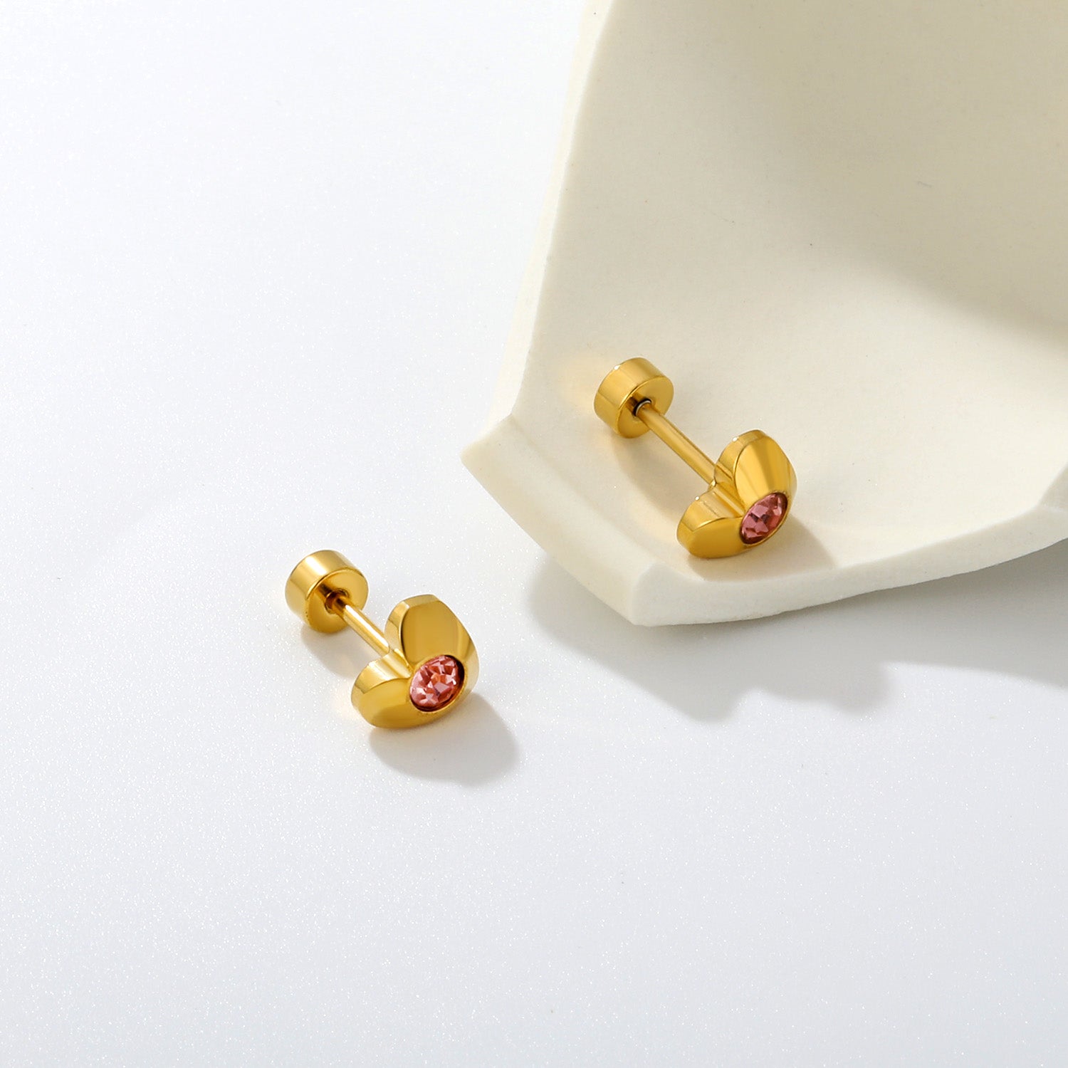 Pink Crystal Heart gold earrings flat lay – 18K gold plated by Twisty Locks