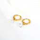 Pear Solitaire Hoops flat lay – 18K gold plated by Twisty Locks