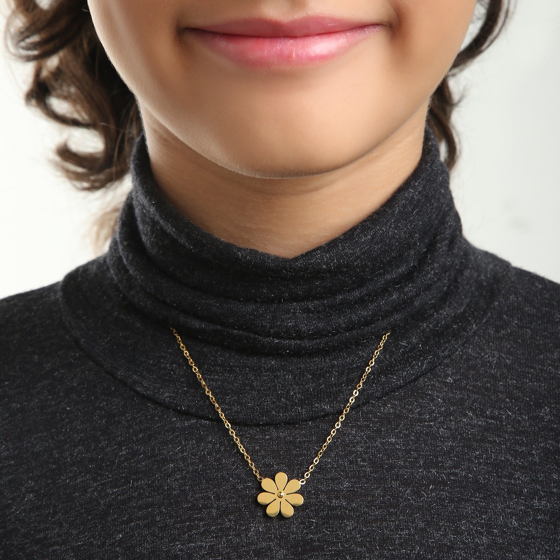 Gold Daisy kids necklace on model – gold jewellery for little ones by Twisty Locks